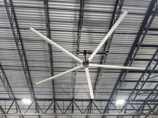 Large industrial ceiling fan in warehouse