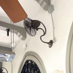 Wall-mounted fan under arched ceiling