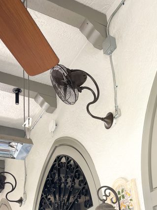 Wall-mounted fan under arched ceiling