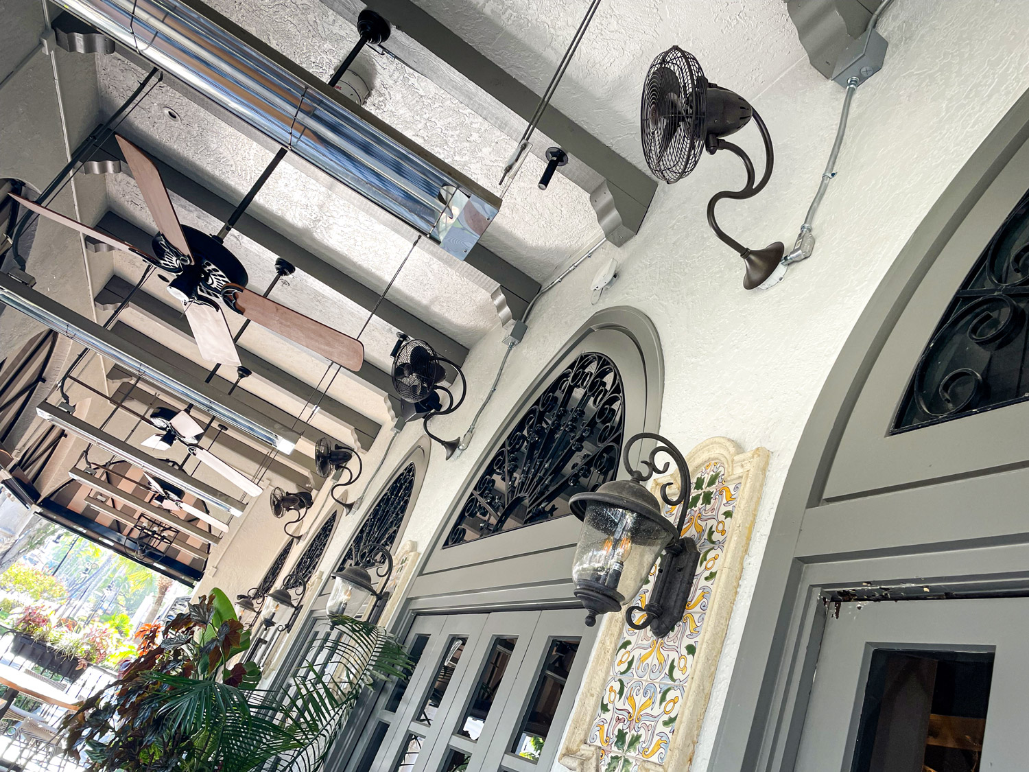 Outdoor patio ceiling with fans and lights